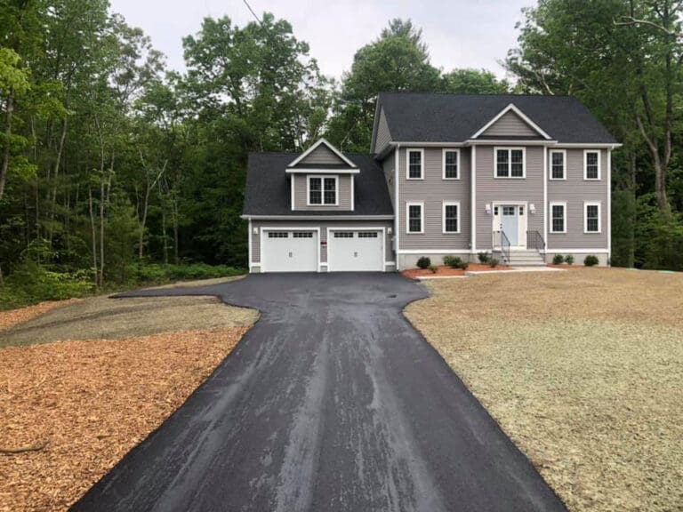 long driveway after being paved by Barry's Paving & Sealcoating