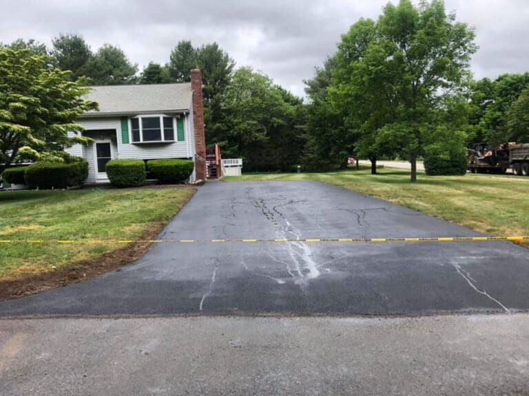 Driveway and pathway after being paved by Barry's Paving & Sealcoating