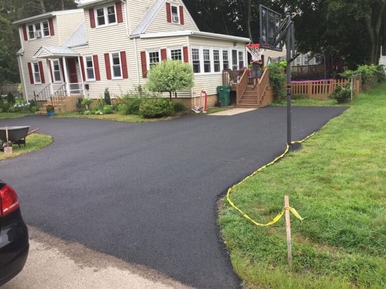 Driveway and pathway after being paved by Barry's Paving & Sealcoating